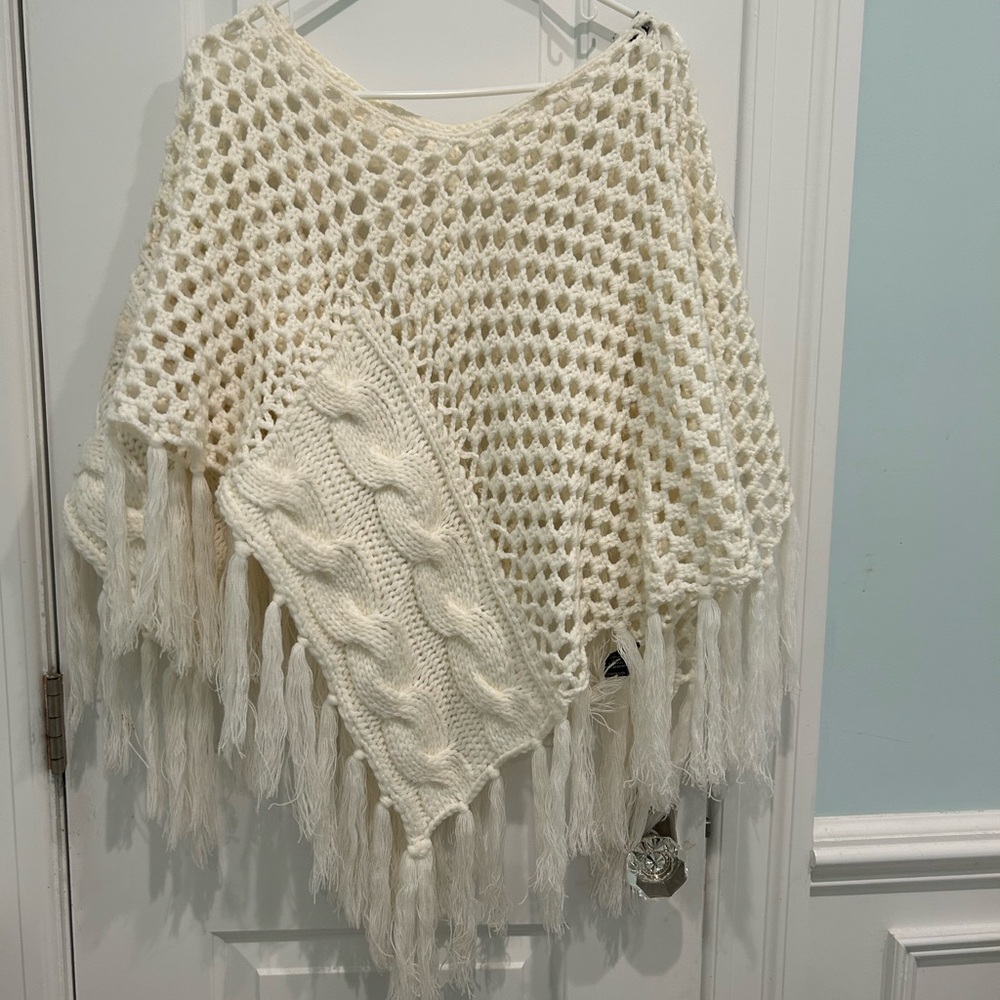 Elegant Cream Knit Poncho with Fringe